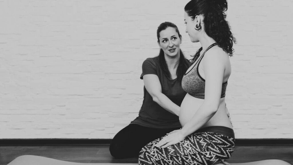 midwife supporting birth Mum